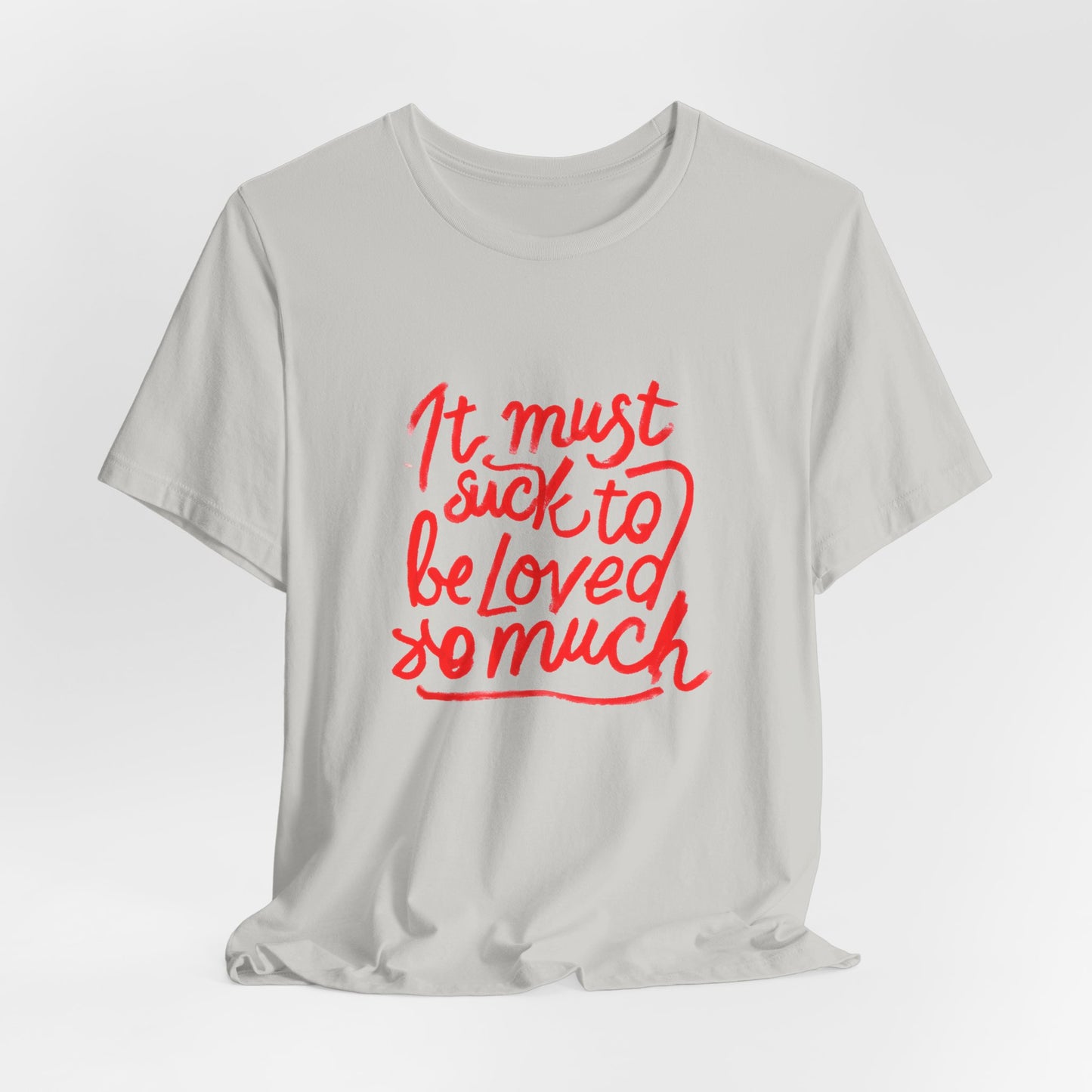 T‑Shirt — “It Must Suck to Be Loved So Much” Red Script Tee