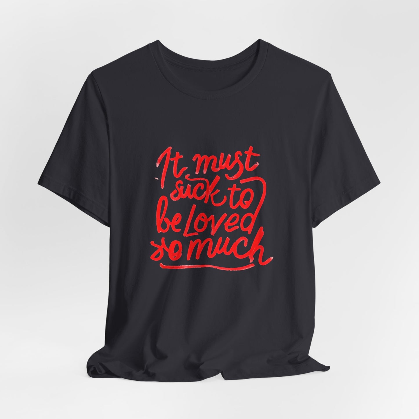 T‑Shirt — “It Must Suck to Be Loved So Much” Red Script Tee