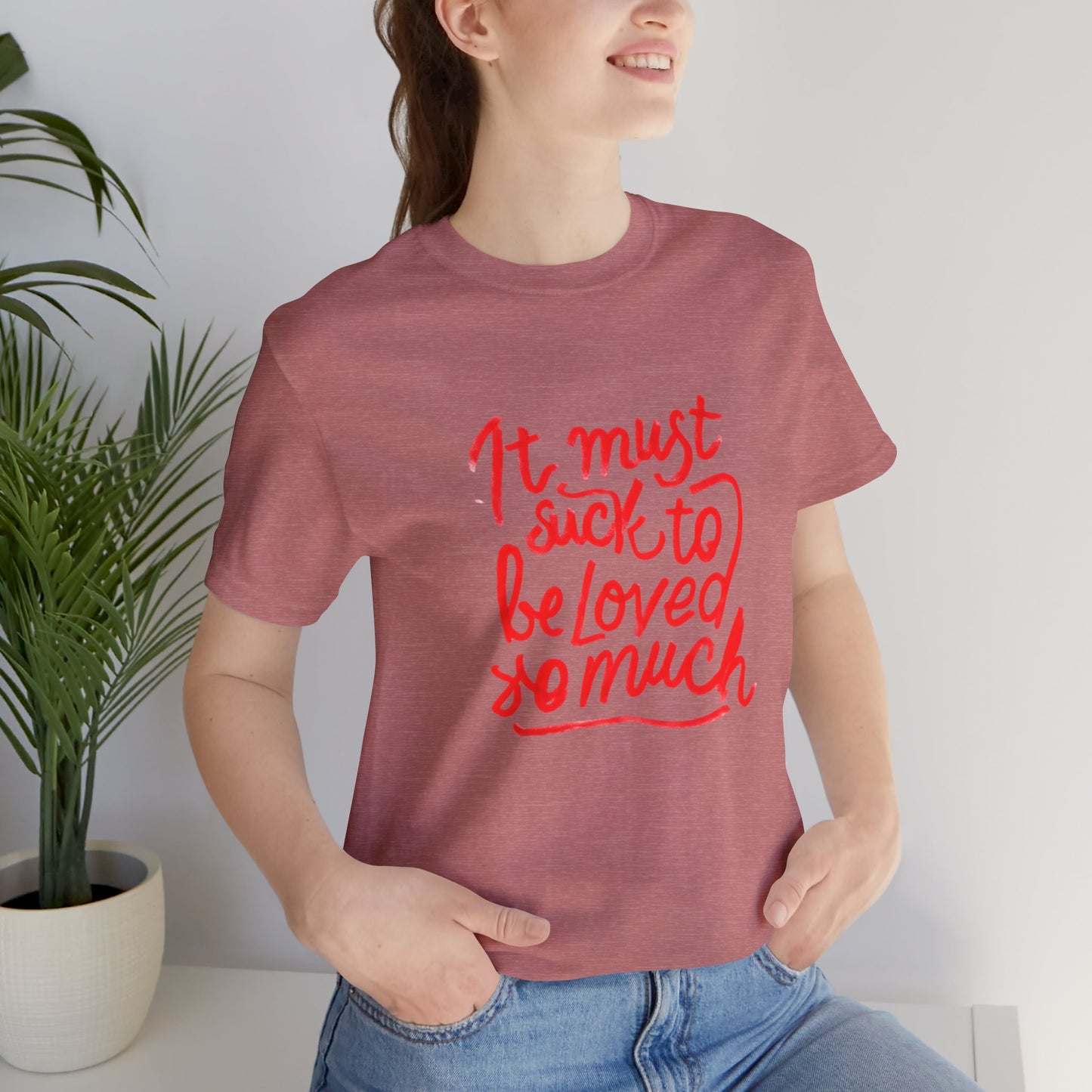 T‑Shirt — “It Must Suck to Be Loved So Much” Red Script Tee