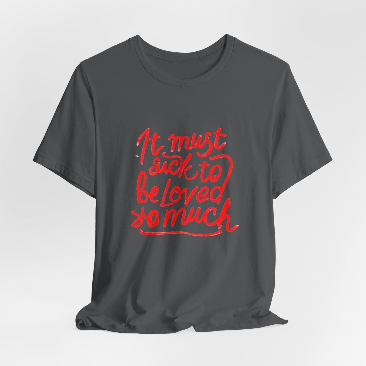 T‑Shirt — “It Must Suck to Be Loved So Much” Red Script Tee