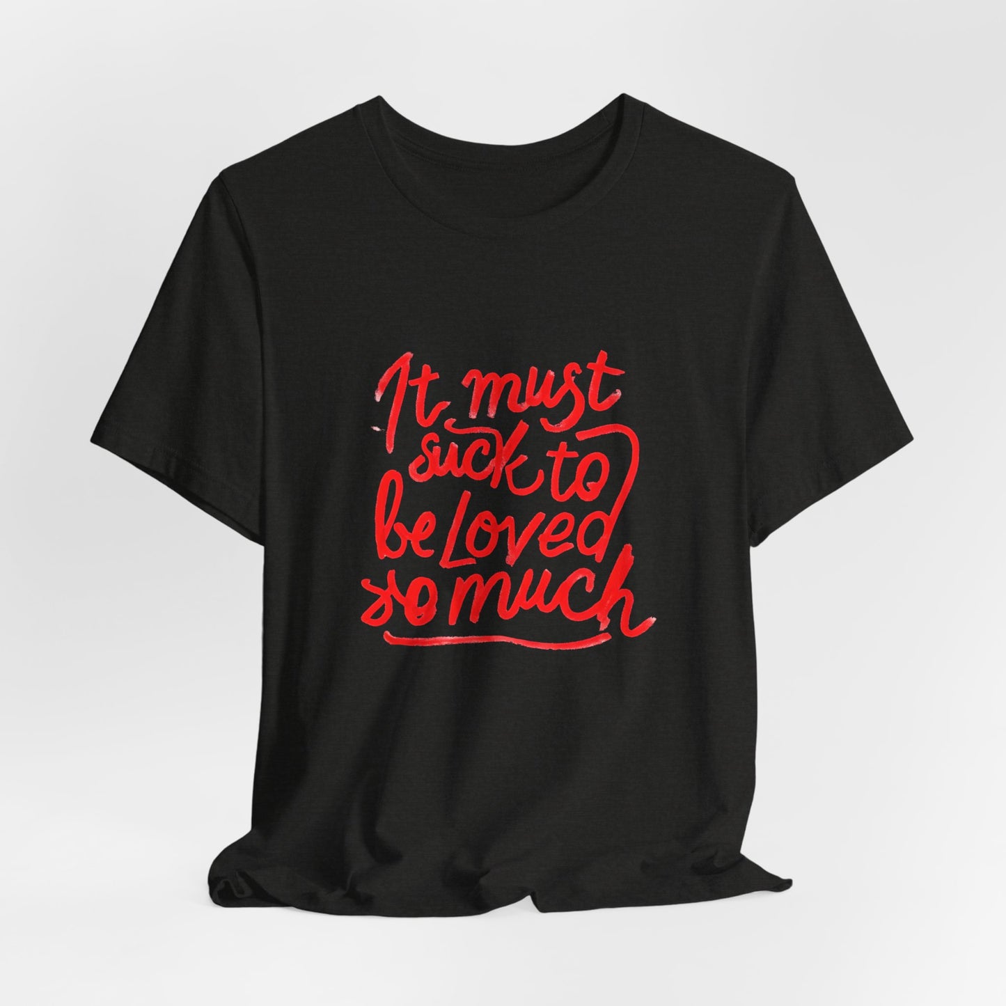 T‑Shirt — “It Must Suck to Be Loved So Much” Red Script Tee