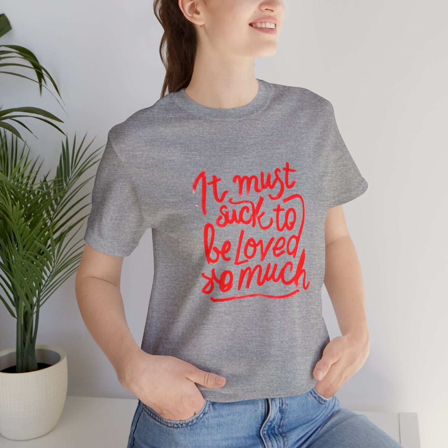 T‑Shirt — “It Must Suck to Be Loved So Much” Red Script Tee