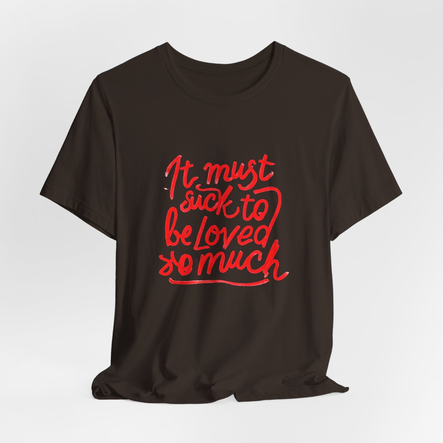 T‑Shirt — “It Must Suck to Be Loved So Much” Red Script Tee