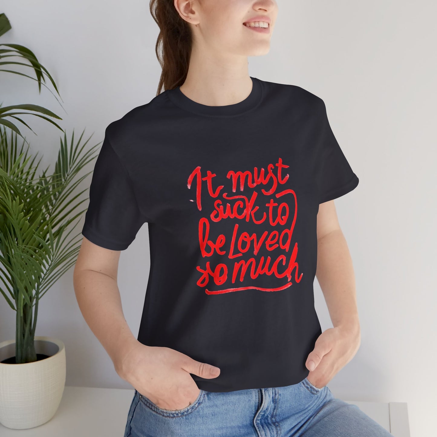 T‑Shirt — “It Must Suck to Be Loved So Much” Red Script Tee