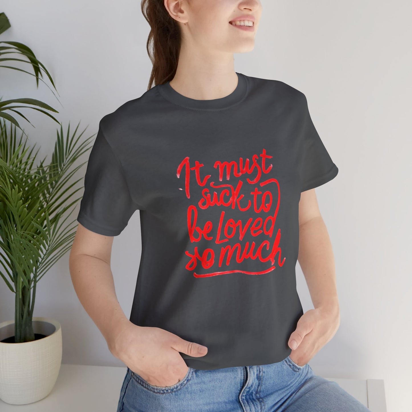 T‑Shirt — “It Must Suck to Be Loved So Much” Red Script Tee