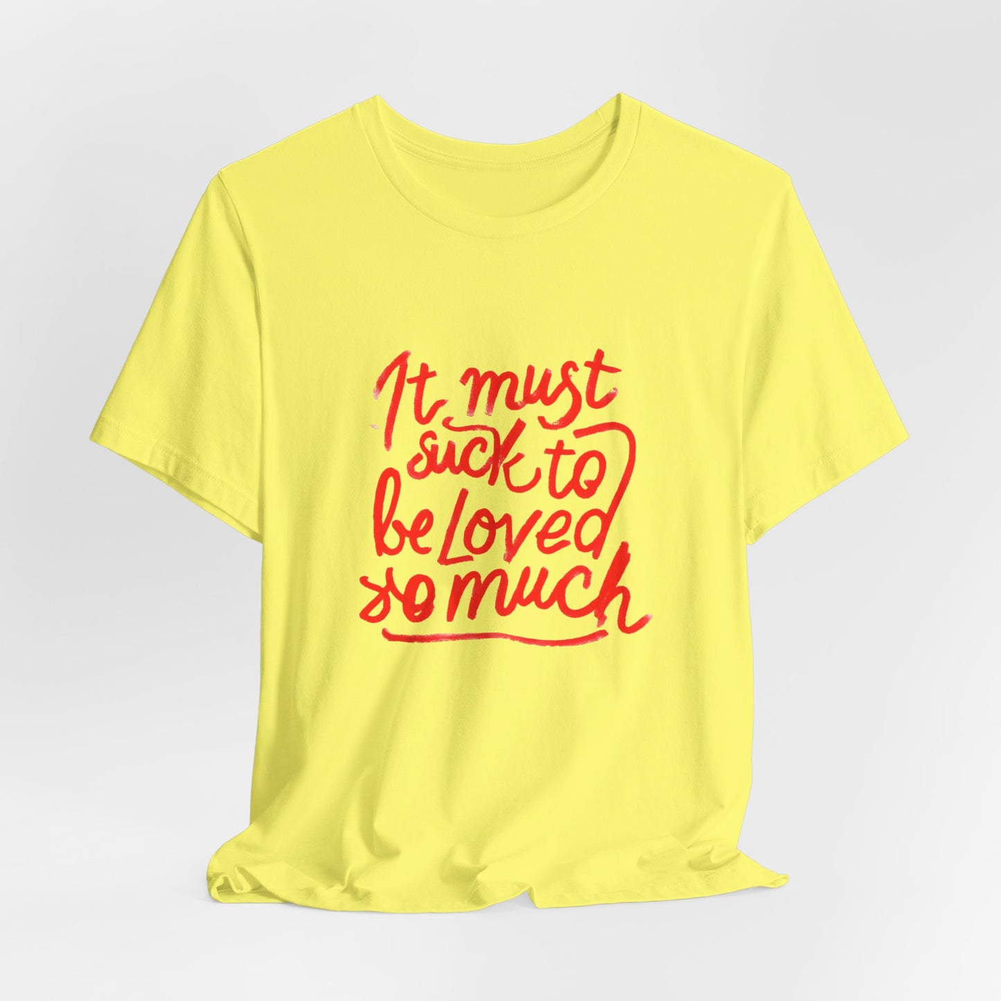 T‑Shirt — “It Must Suck to Be Loved So Much” Red Script Tee